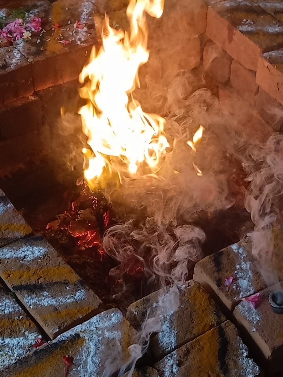Sacred fire burning in a ritual pit